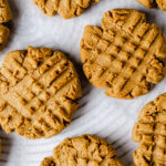 Close-up of gluten-free peanut butter cookies on a cooling rack.