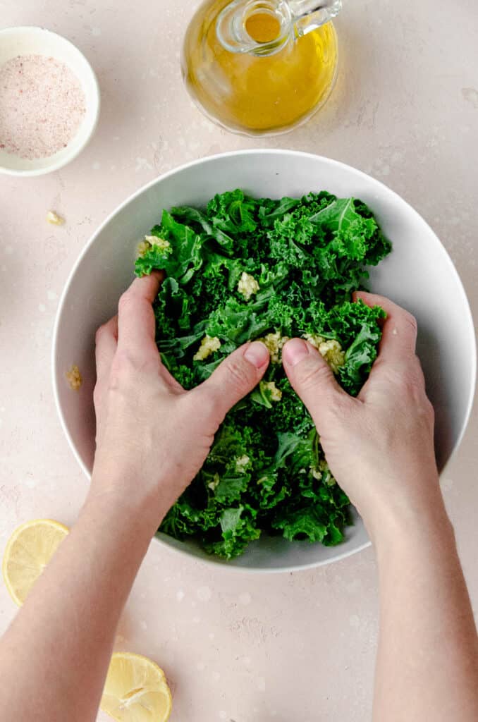 Massing kale with olive oil and salt is the key to making kale salad.