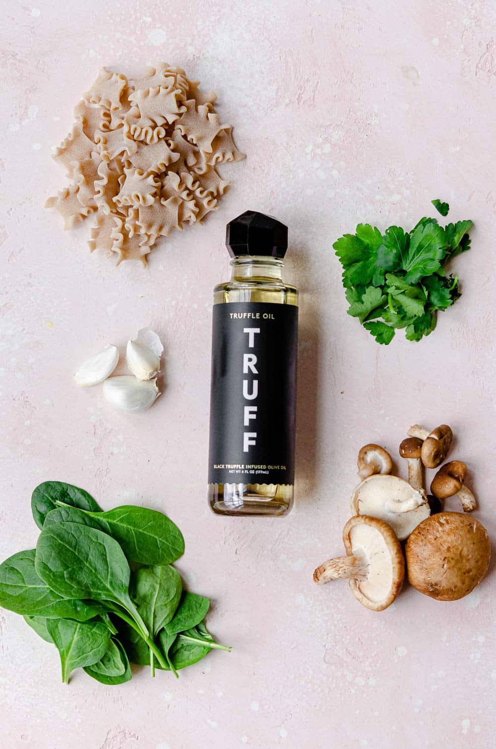 Ingredients for truffle mushroom pasta with spinach - whole wheat pasta, truffle oil, parsley, garlic, assorted mushrooms, baby spinach 